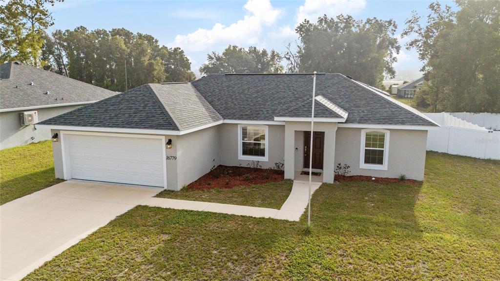 16779 Southwest 17th Avenue Ocala, FL 34473 - Photo 31 of 34 a view of a house with pool and yard