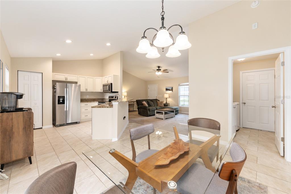 16779 Southwest 17th Avenue Ocala, FL 34473 - Photo 9 of 34 a view of a dining room kitchen and a chandelier