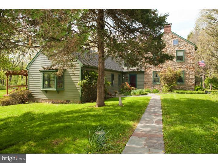 3050 Cooks Creek Road Riegelsville, PA 18077 - Photo 1 of 25 a front view of a house with a yard and trees