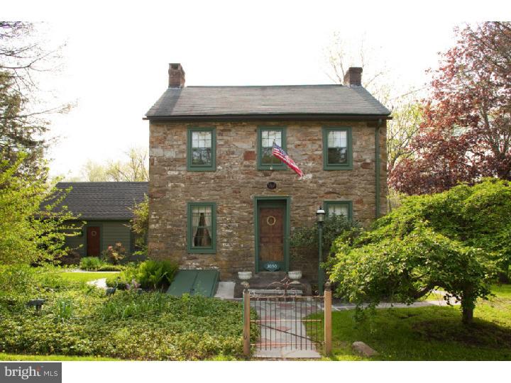 3050 Cooks Creek Road Riegelsville, PA 18077 - Photo 2 of 25 a front view of a house with garden