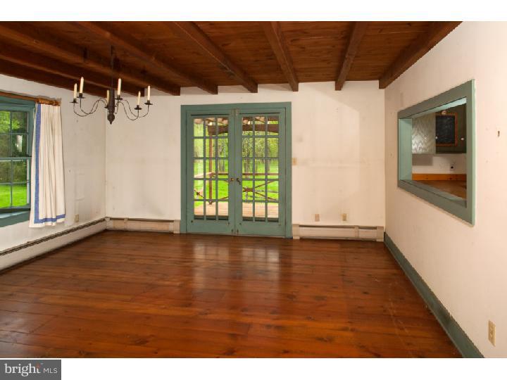 3050 Cooks Creek Road Riegelsville, PA 18077 - Photo 11 of 25 a view of a room with wooden floor and windows
