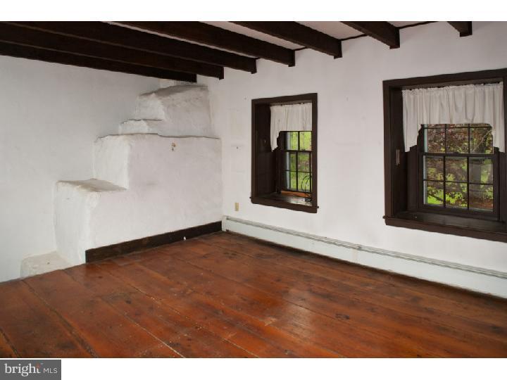 3050 Cooks Creek Road Riegelsville, PA 18077 - Photo 14 of 25 a view of an empty room with wooden floor and a window