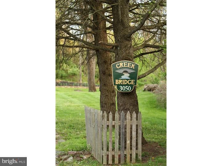 3050 Cooks Creek Road Riegelsville, PA 18077 - Photo 3 of 25 a view of a bench in a yard