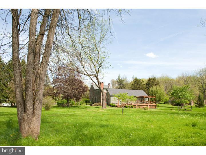 3050 Cooks Creek Road Riegelsville, PA 18077 - Photo 25 of 25 a view of an house with garden space and trees