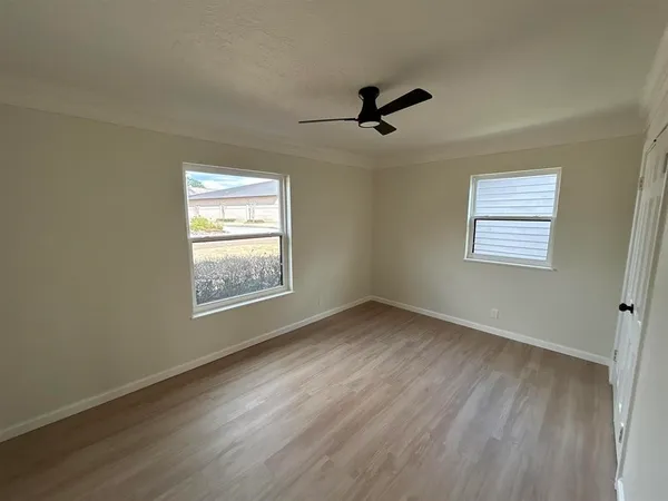 a view of an empty room and a window