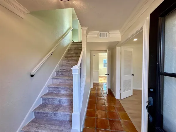 a view of a gallery with stairs