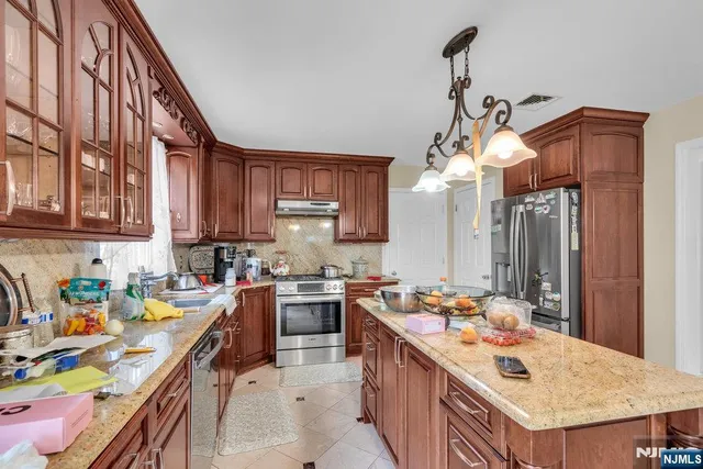 a kitchen that has a lot of cabinets in it