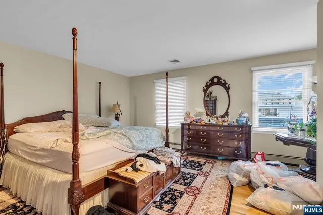 a bed room with a bed and a window