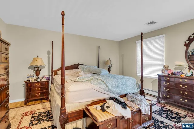 a living room with a bed and furniture