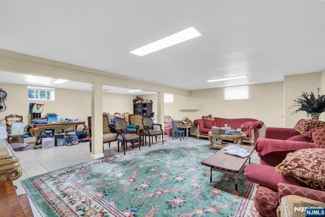 a living room with lots of furniture and a wooden floor
