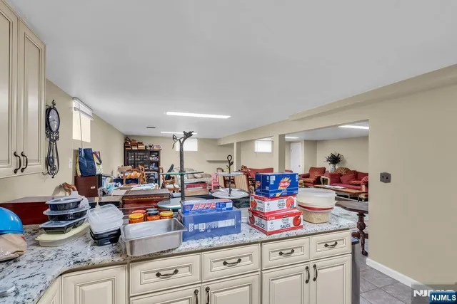 a living room with lots of furniture and a wooden floor