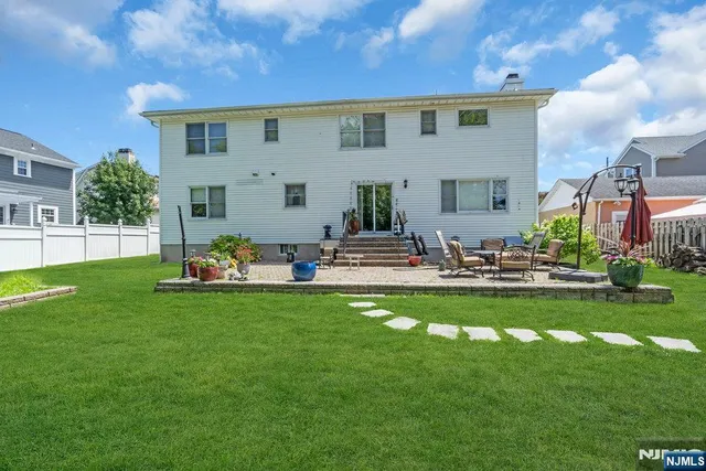 a front view of a house with sitting area