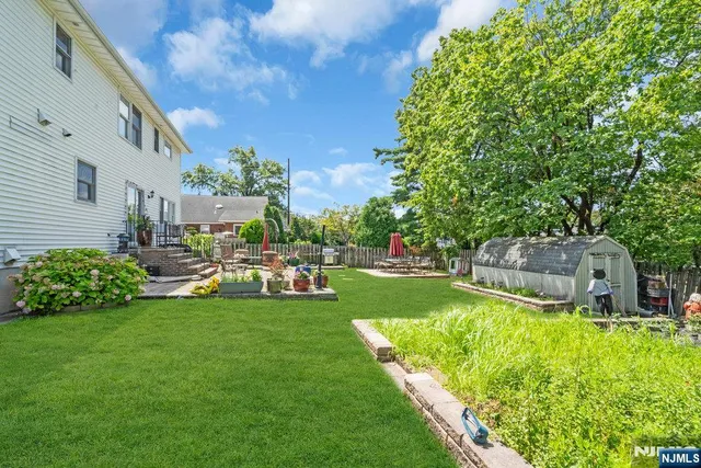 a view of a garden with houses