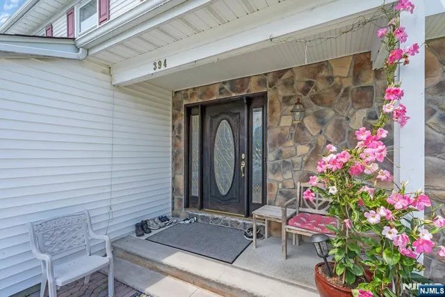 a front view of a house with sitting area