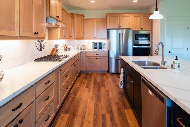 a living room with lots of books and a book shelf