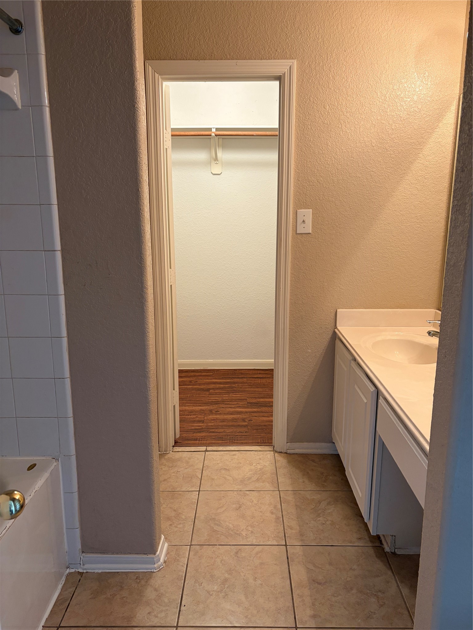 13230 Montclair Point Court Houston, TX 77047 - Photo 12 of 16 a bathroom with a granite countertop sink and washing machine