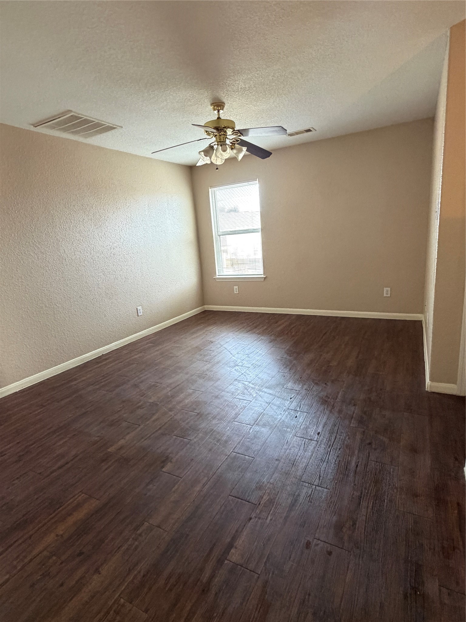 13230 Montclair Point Court Houston, TX 77047 - Photo 5 of 16 wooden floor in an empty room with a window