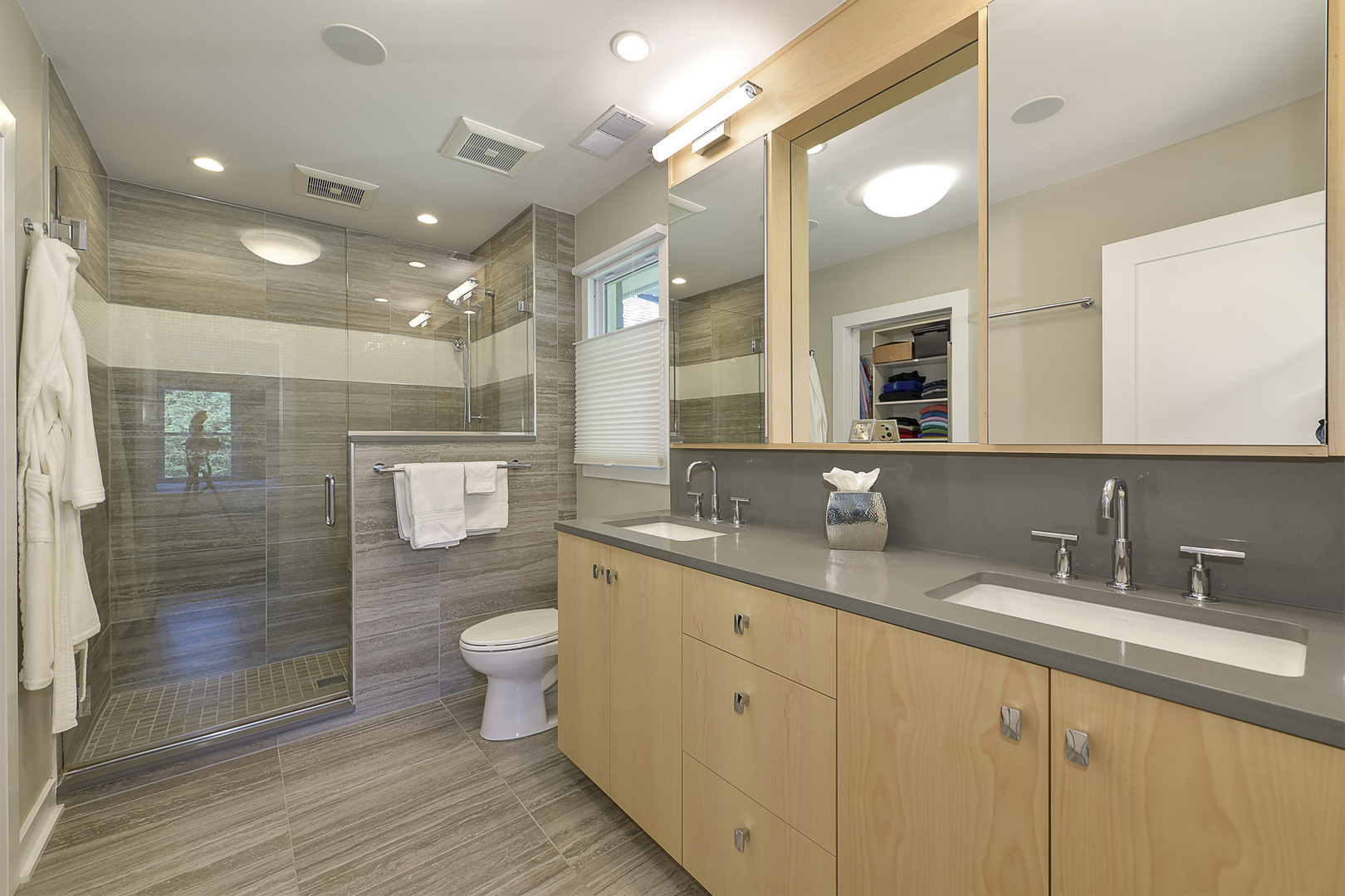 1500 Appleby Road Inverness, IL 60067 - Photo 16 of 27 a bathroom with a granite countertop sink a toilet a shower and a mirror
