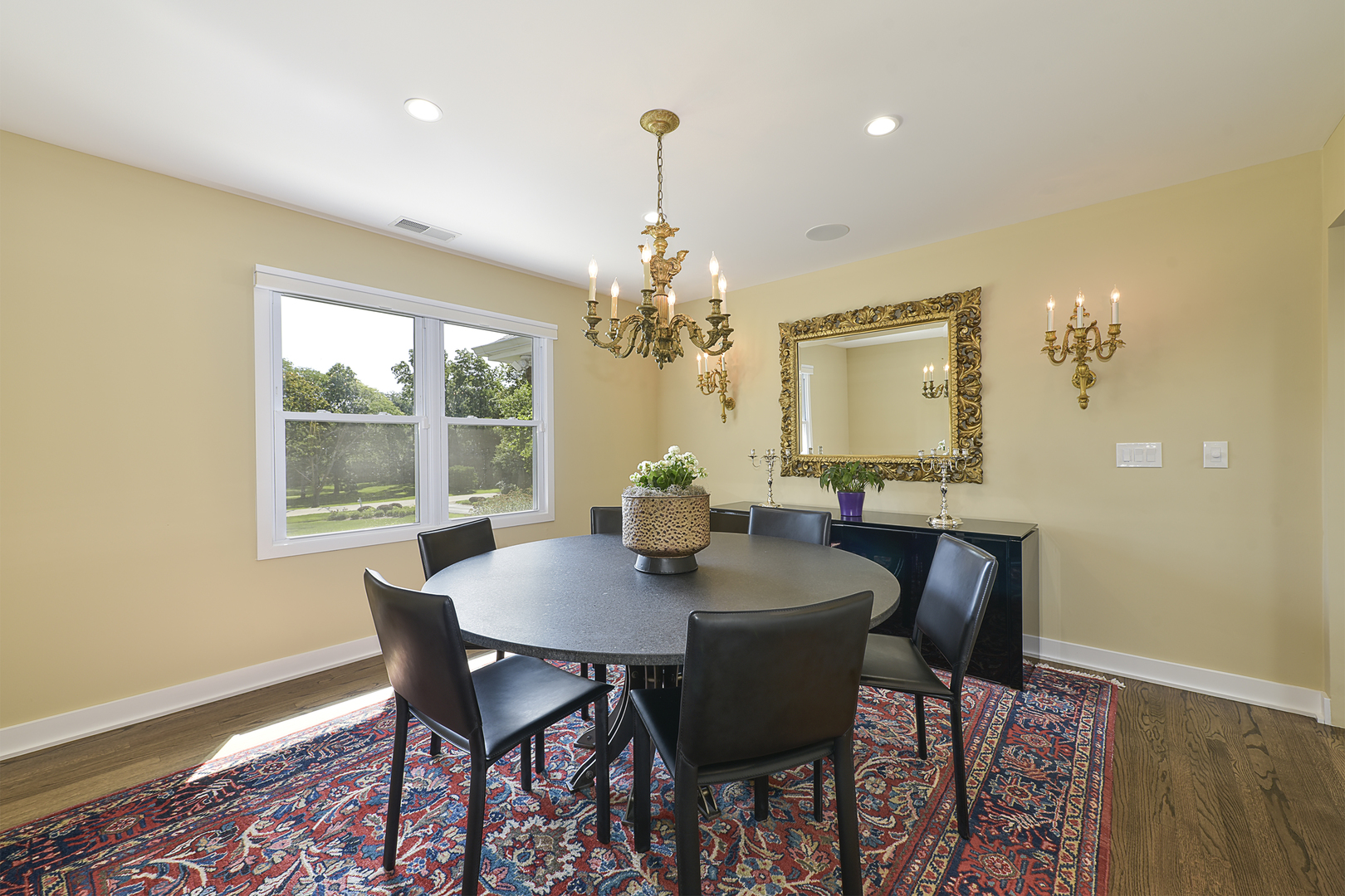 1500 Appleby Road Inverness, IL 60067 - Photo 5 of 27 a dining room with furniture a chandelier and wooden floor