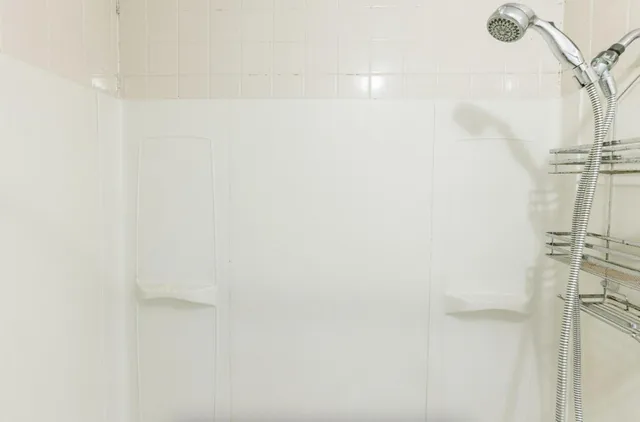 a white toilet sitting in a bathroom