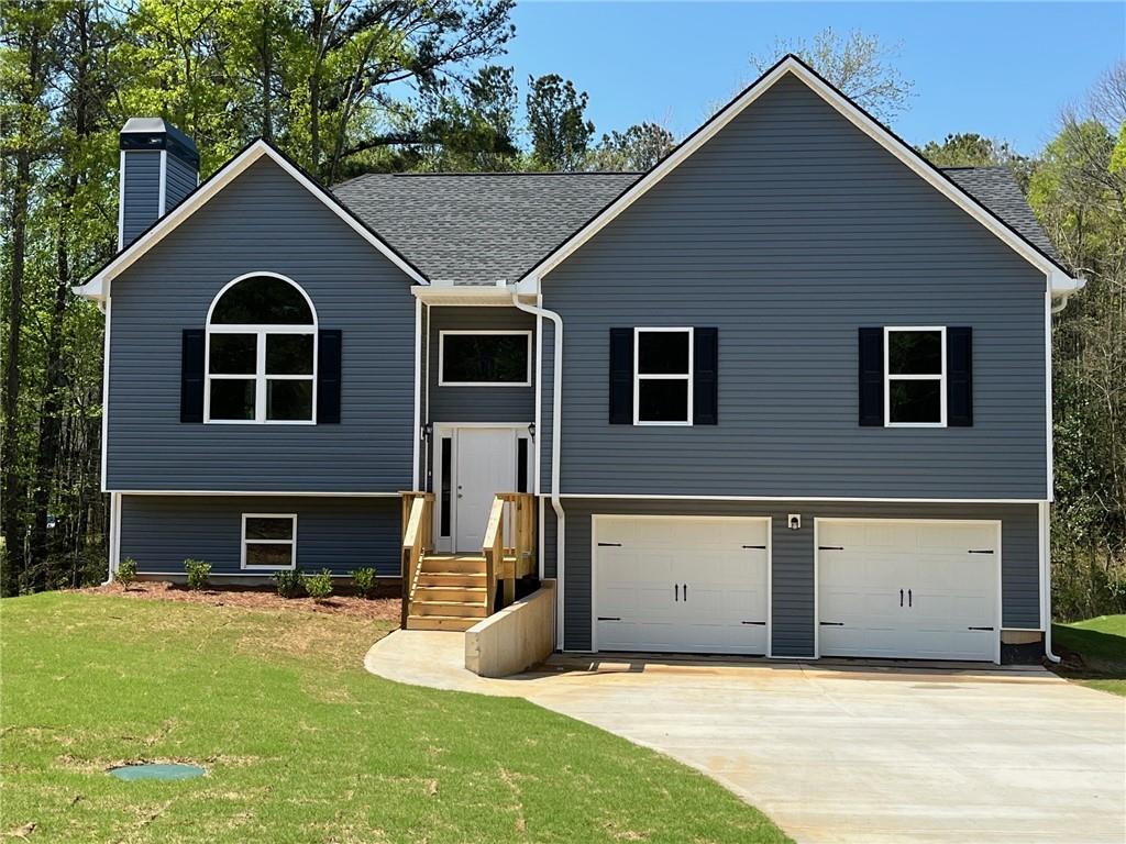 a front view of a house with a yard