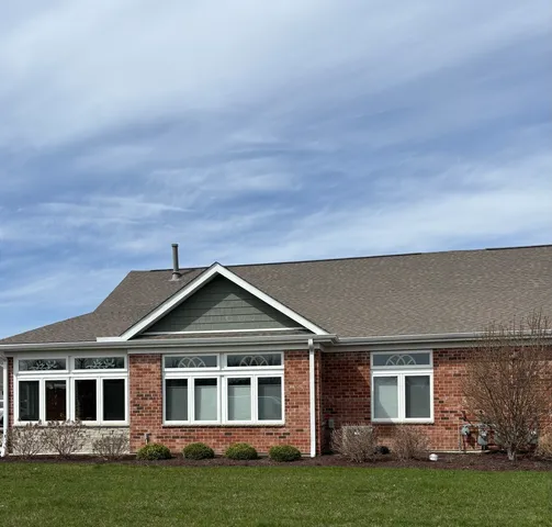 front view of a house with a garden