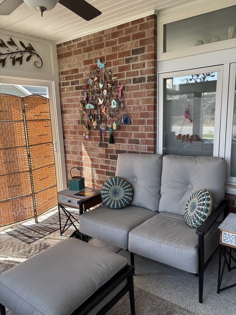 408 Stearn Drive, Unit 408 Genoa, IL 60135 - Photo 17 of 34 a living room with furniture and a potted plant
