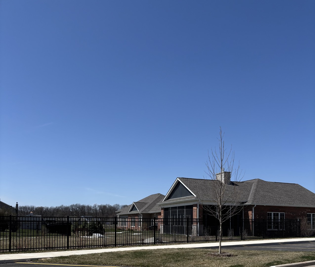 408 Stearn Drive, Unit 408 Genoa, IL 60135 - Photo 28 of 34 a front view of a house with a garden