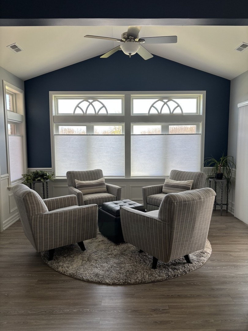 408 Stearn Drive, Unit 408 Genoa, IL 60135 - Photo 5 of 34 a living room with furniture wooden floor and a large window