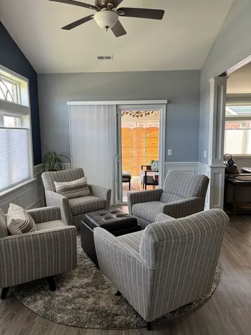 a living room with furniture and a window