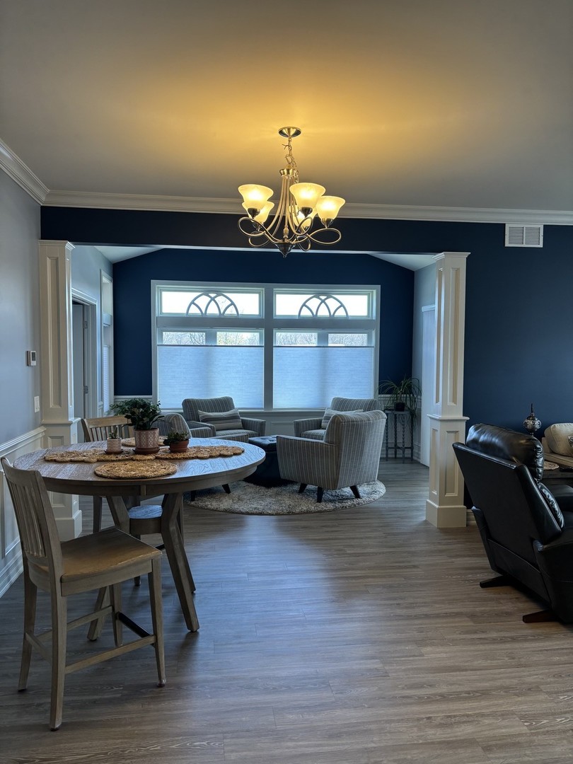 408 Stearn Drive, Unit 408 Genoa, IL 60135 - Photo 7 of 34 a living room with furniture and a wooden floor