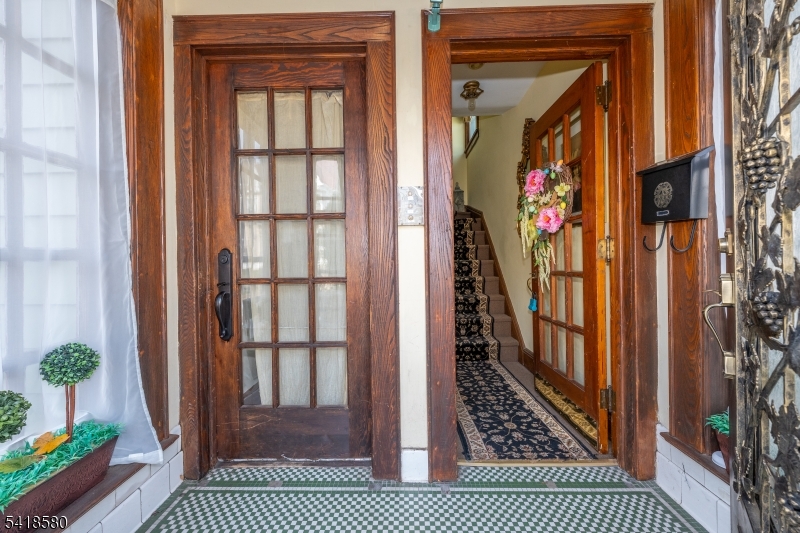 a view of a door and wooden floor