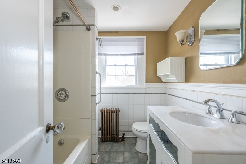 41 Beekman Street, Unit 3 Bloomfield, NJ 07003 - Photo 11 of 12 a bathroom with a sink and a bathtub