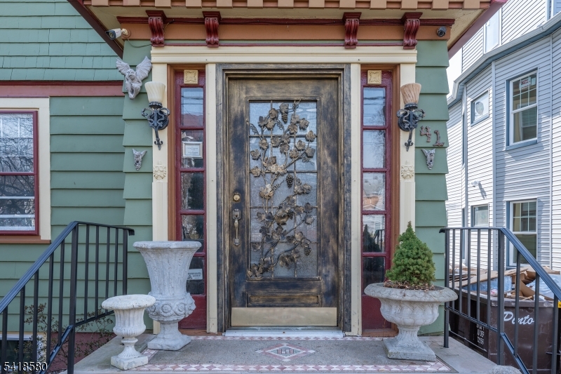41 Beekman Street, Unit 3 Bloomfield, NJ 07003 - Photo 4 of 12 a view of a porch with a door and wooden floor