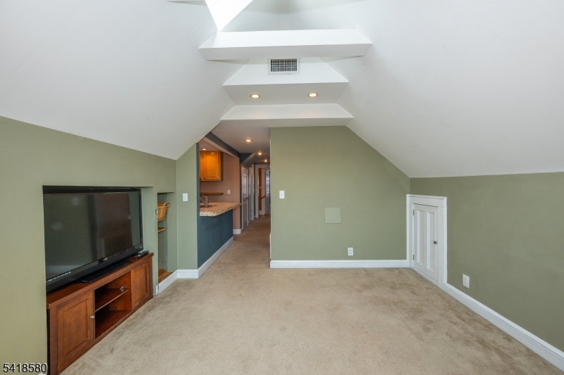 41 Beekman Street, Unit 3 Bloomfield, NJ 07003 - Photo 5 of 12 a view of a hallway with an empty room