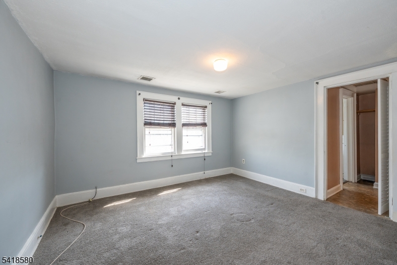 41 Beekman Street, Unit 3 Bloomfield, NJ 07003 - Photo 7 of 12 an empty room with a window