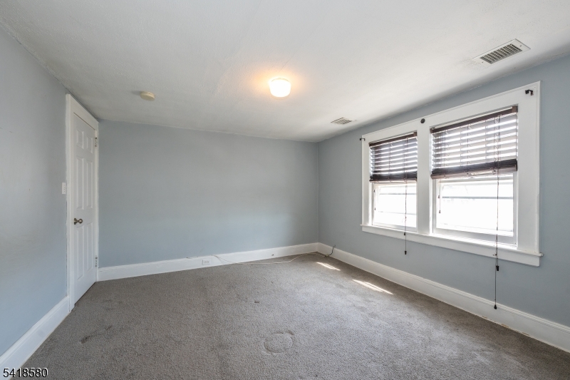 41 Beekman Street, Unit 3 Bloomfield, NJ 07003 - Photo 9 of 12 an empty room with a window