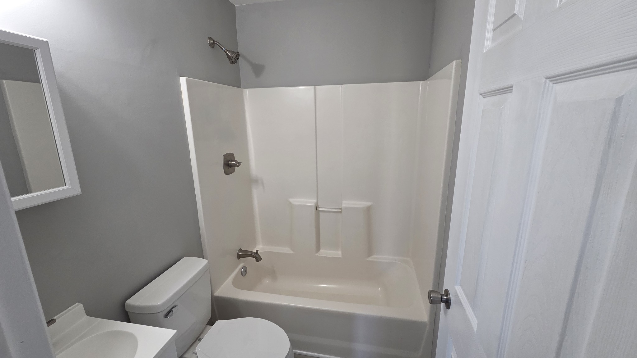 6414 Amanda Way Murfreesboro, TN 37129 - Photo 4 of 13 a bathroom with a toilet and a bathtub