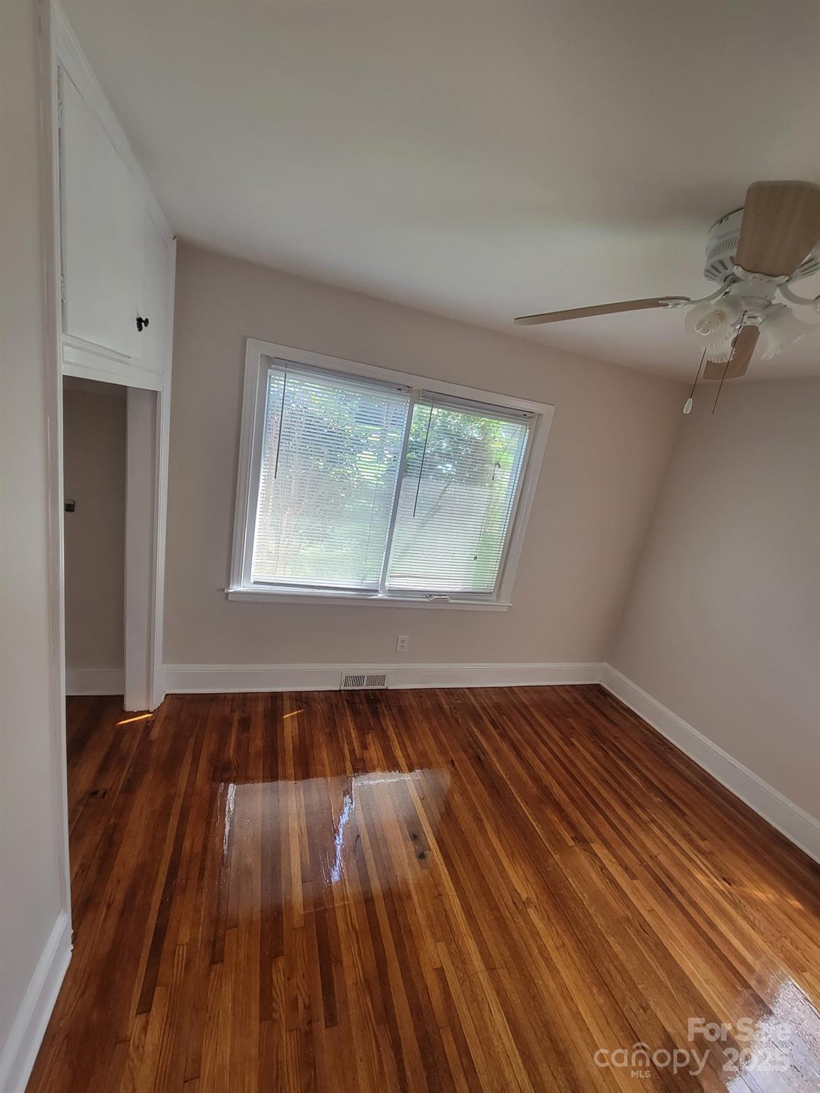 1733 Merry Oaks Road Charlotte, NC 28205 - Photo 3 of 11 wooden floor in an empty room with a window