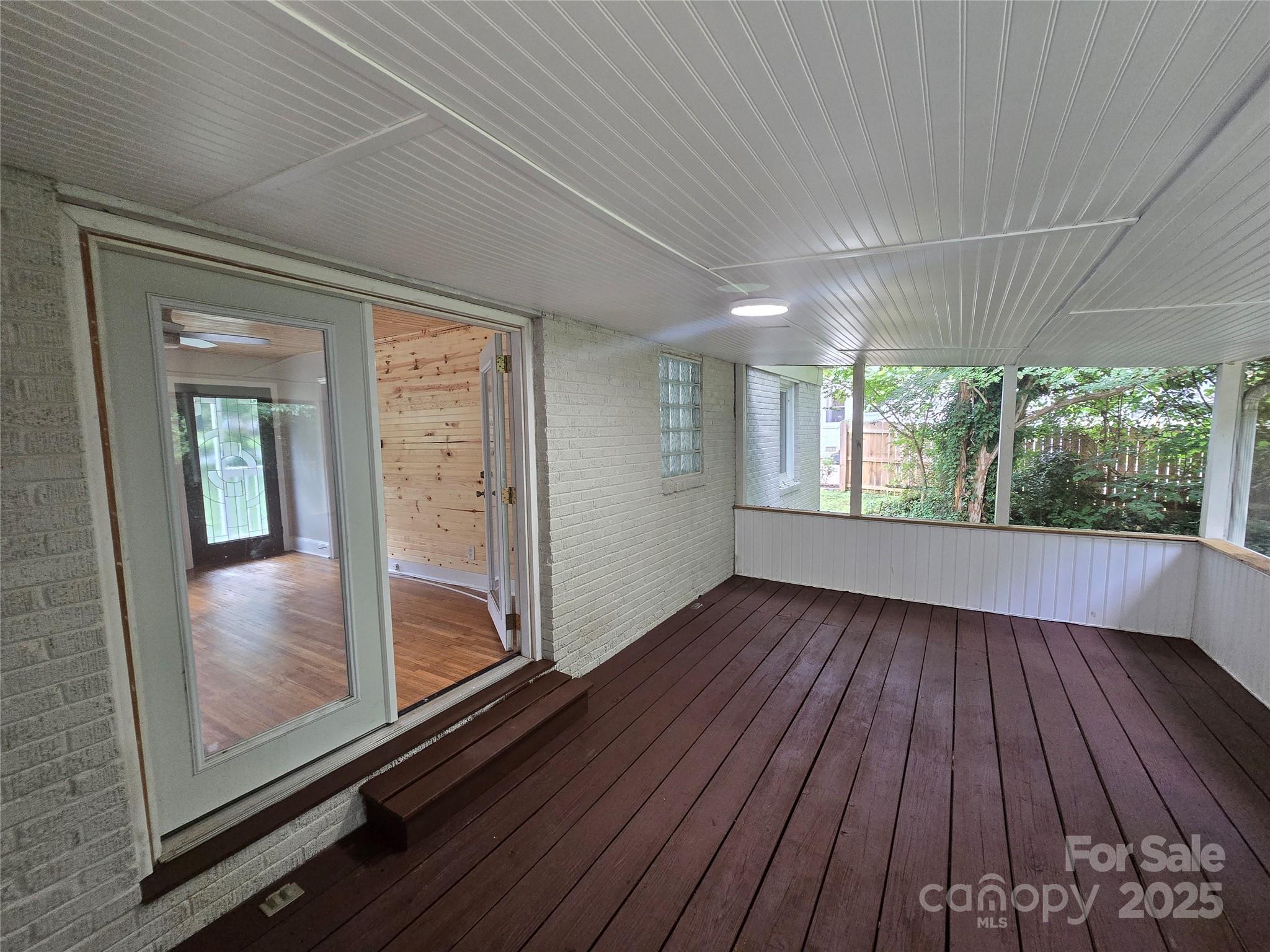 1733 Merry Oaks Road Charlotte, NC 28205 - Photo 10 of 11 a view of hallway with a large window and wooden floor