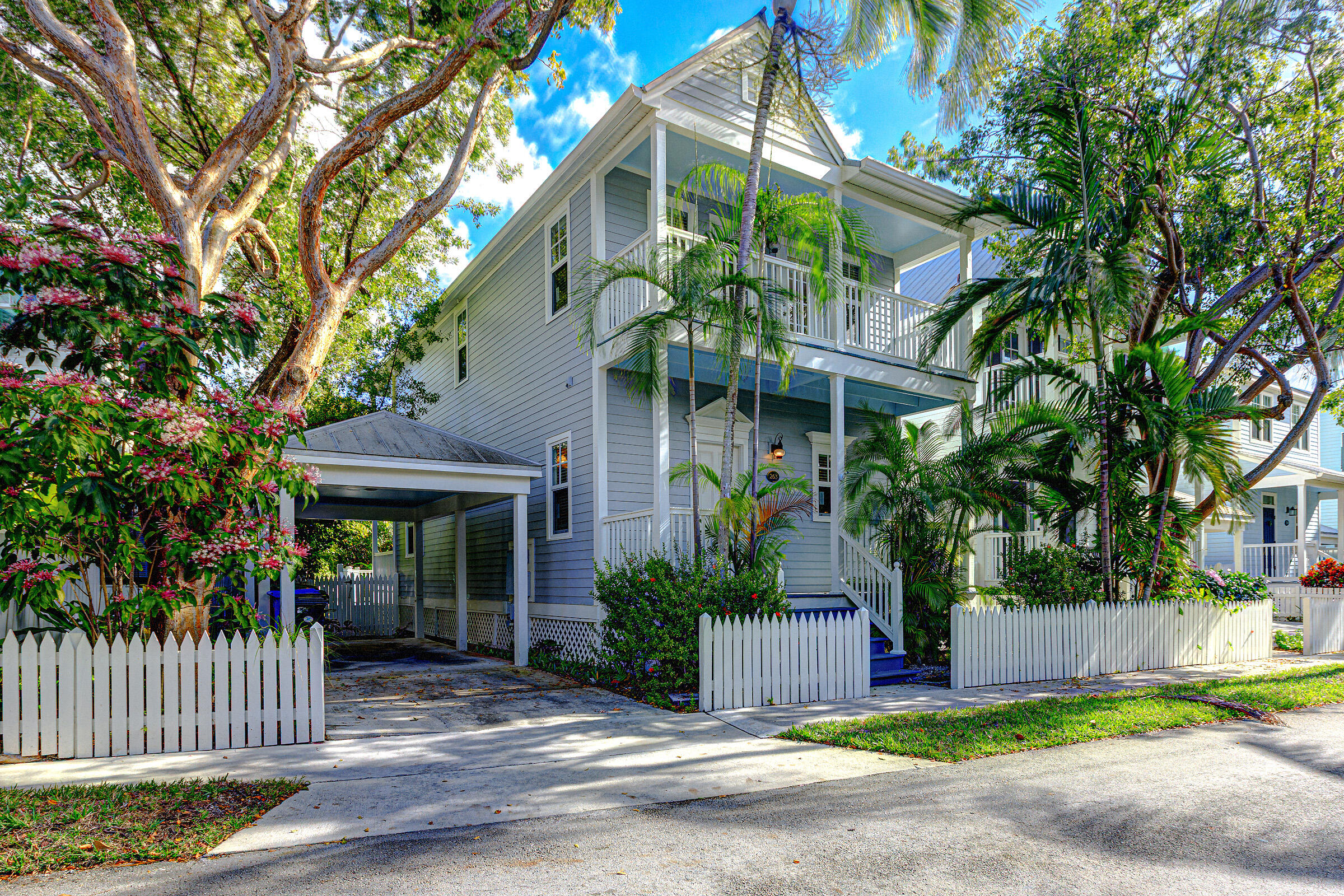 263 Golf Club Drive Key West, FL 33040 - Photo 1 of 30 a front view of a house with garden