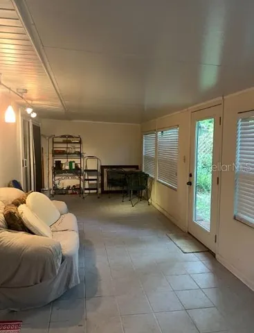 a room with furniture and a large window