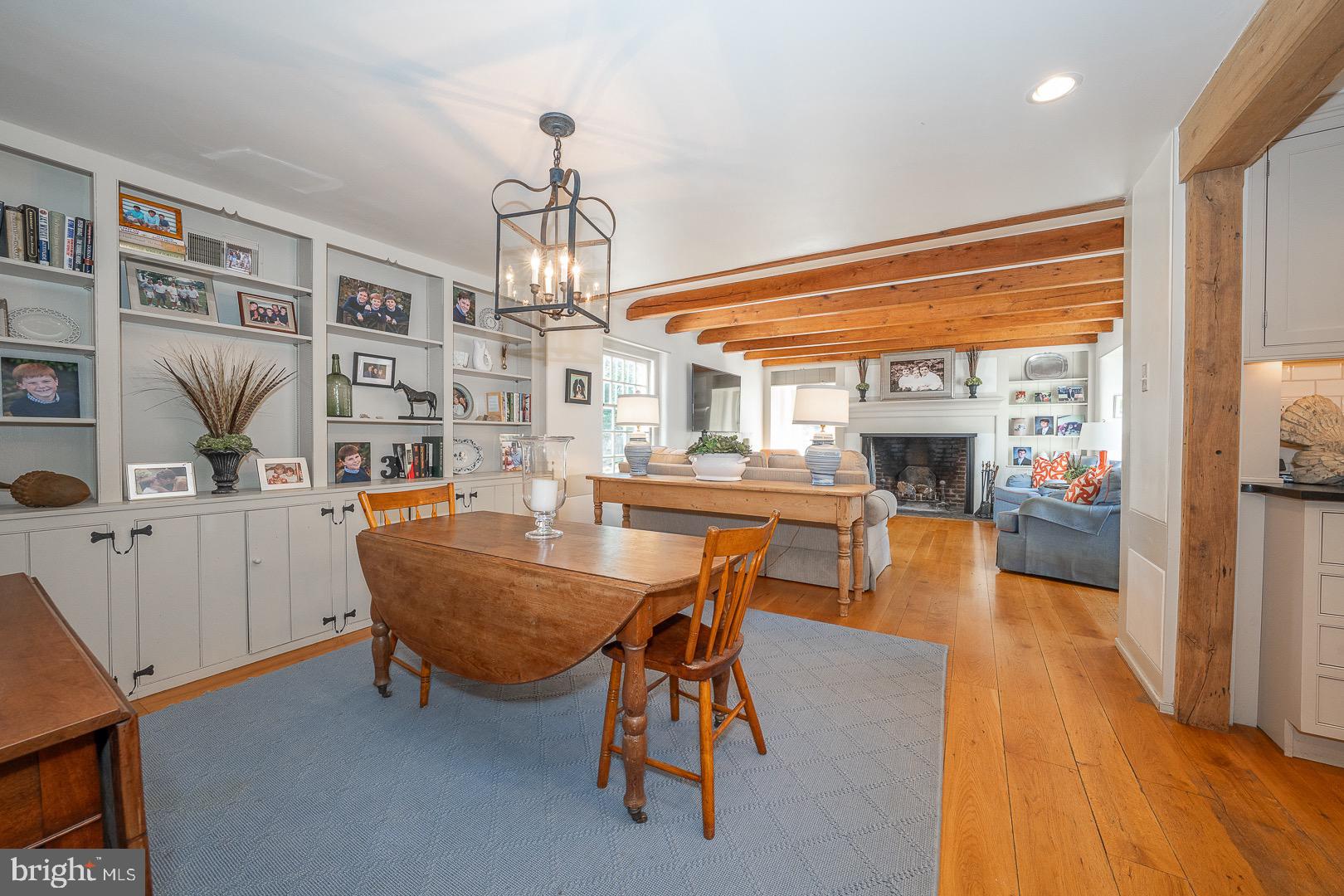 395 Bair Road Berwyn, PA 19312 - Photo 17 of 51 a living room with furniture a dining table and a floor to ceiling window