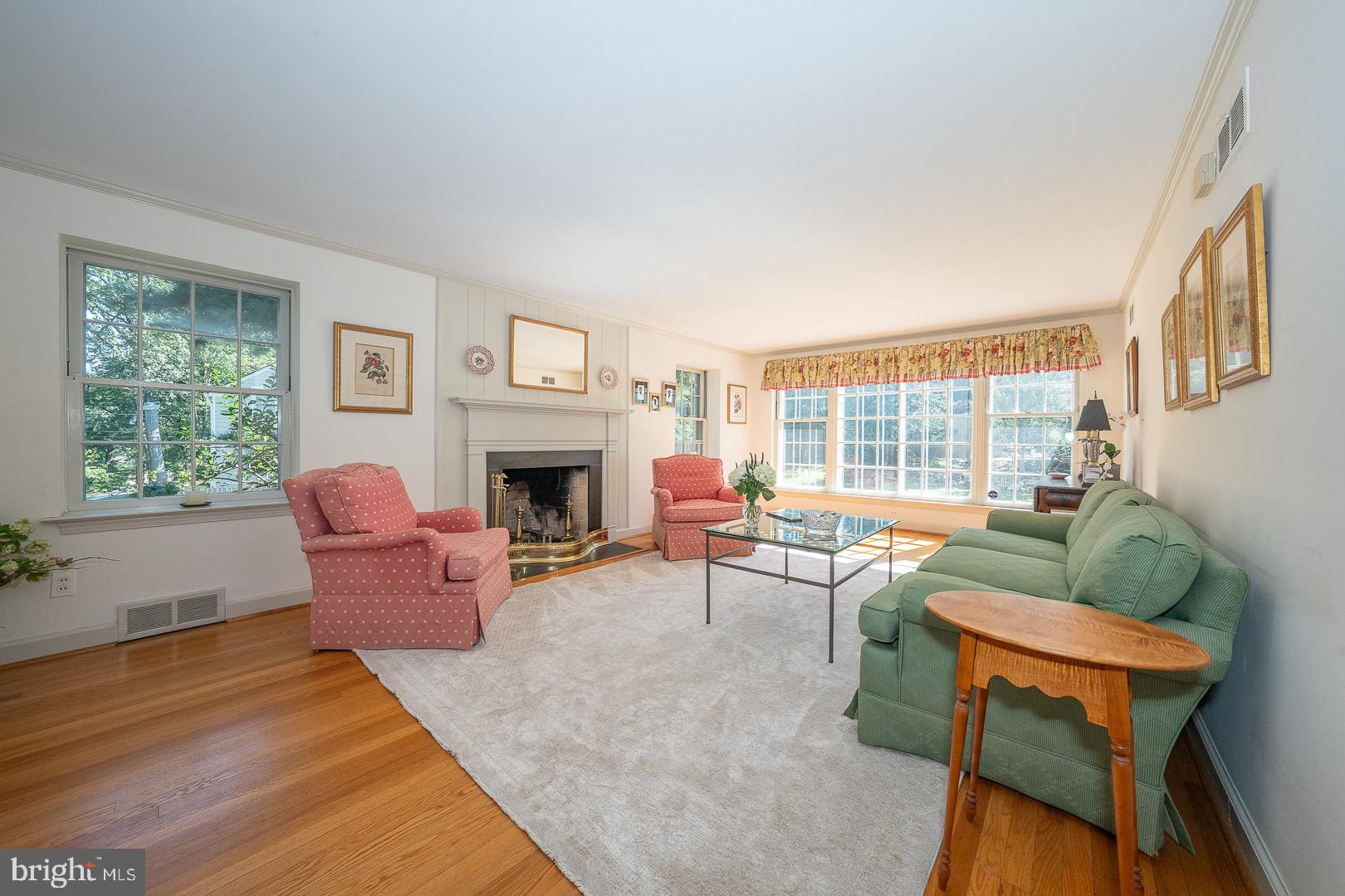 395 Bair Road Berwyn, PA 19312 - Photo 23 of 51 a living room with furniture a fireplace and a large window