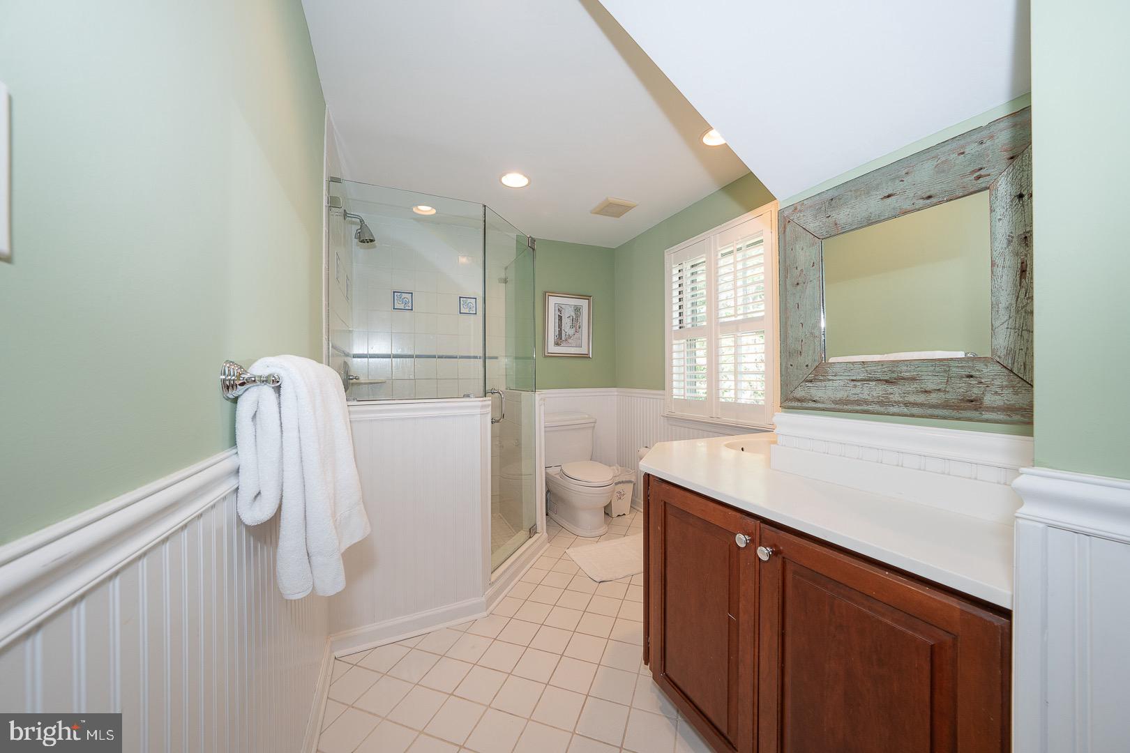 395 Bair Road Berwyn, PA 19312 - Photo 27 of 51 a bathroom with a sink a toilet and a mirror