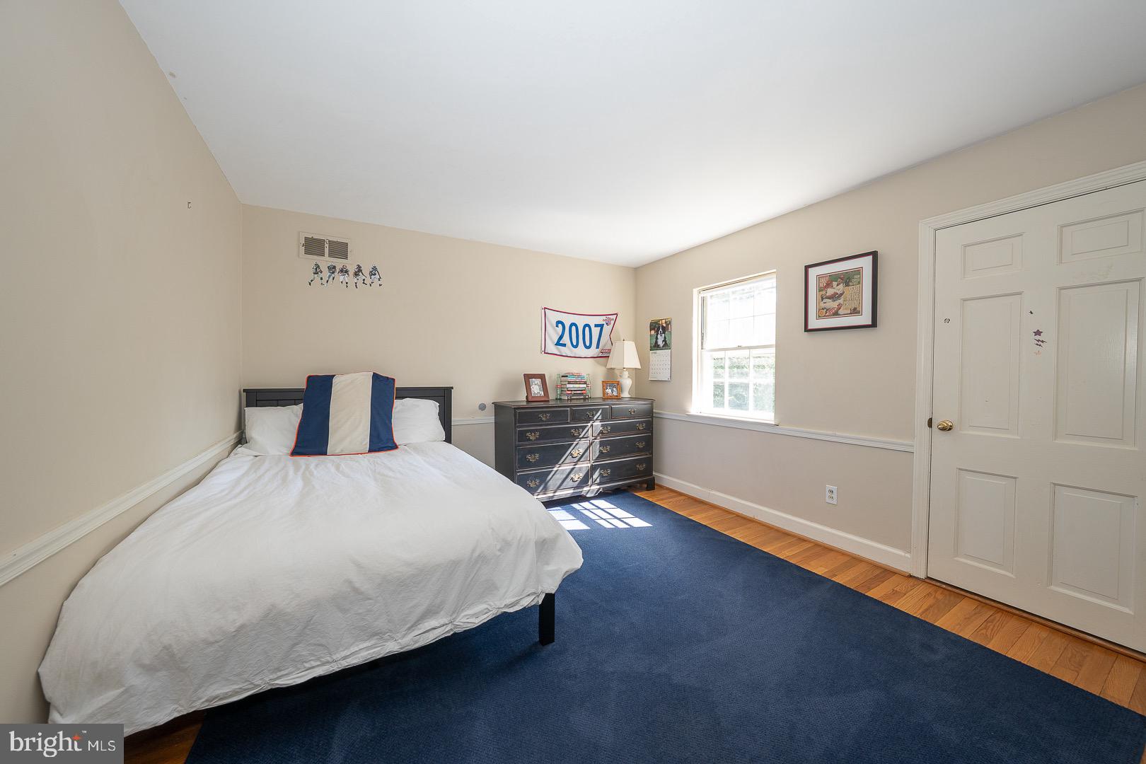 395 Bair Road Berwyn, PA 19312 - Photo 30 of 51 a bedroom with a bed and wooden floor