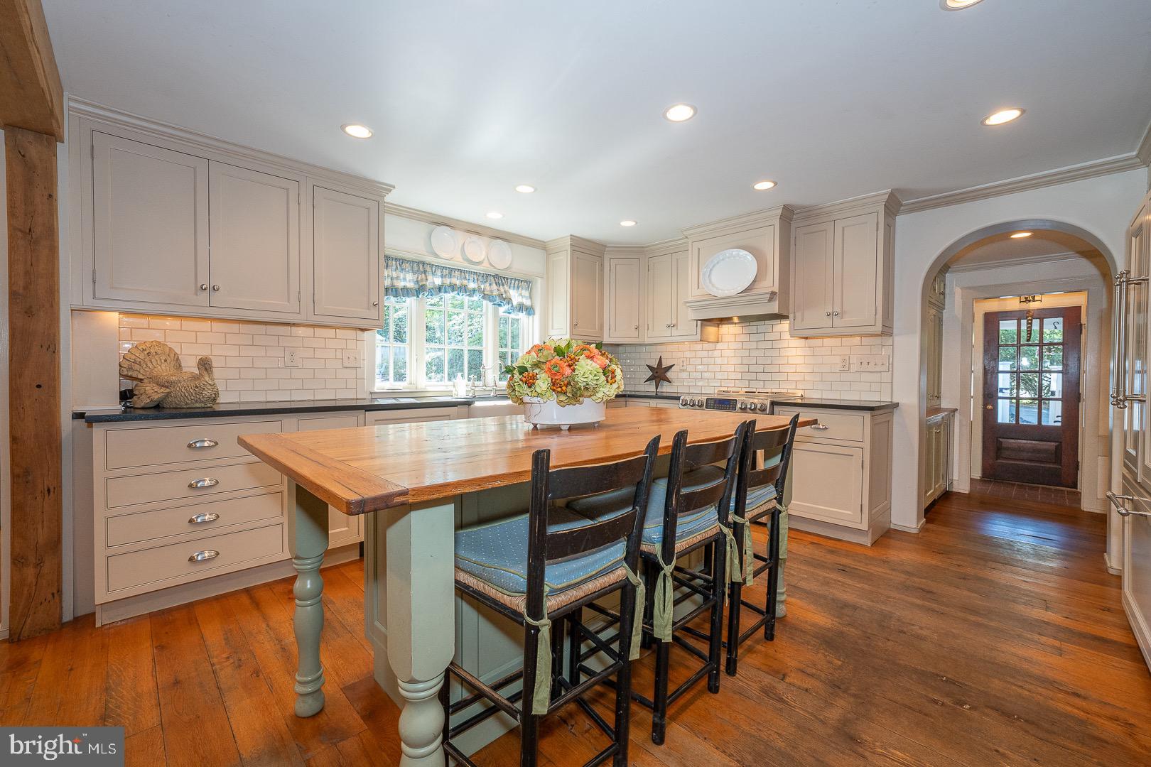 395 Bair Road Berwyn, PA 19312 - Photo 9 of 51 a kitchen with granite countertop a table chairs sink and cabinets