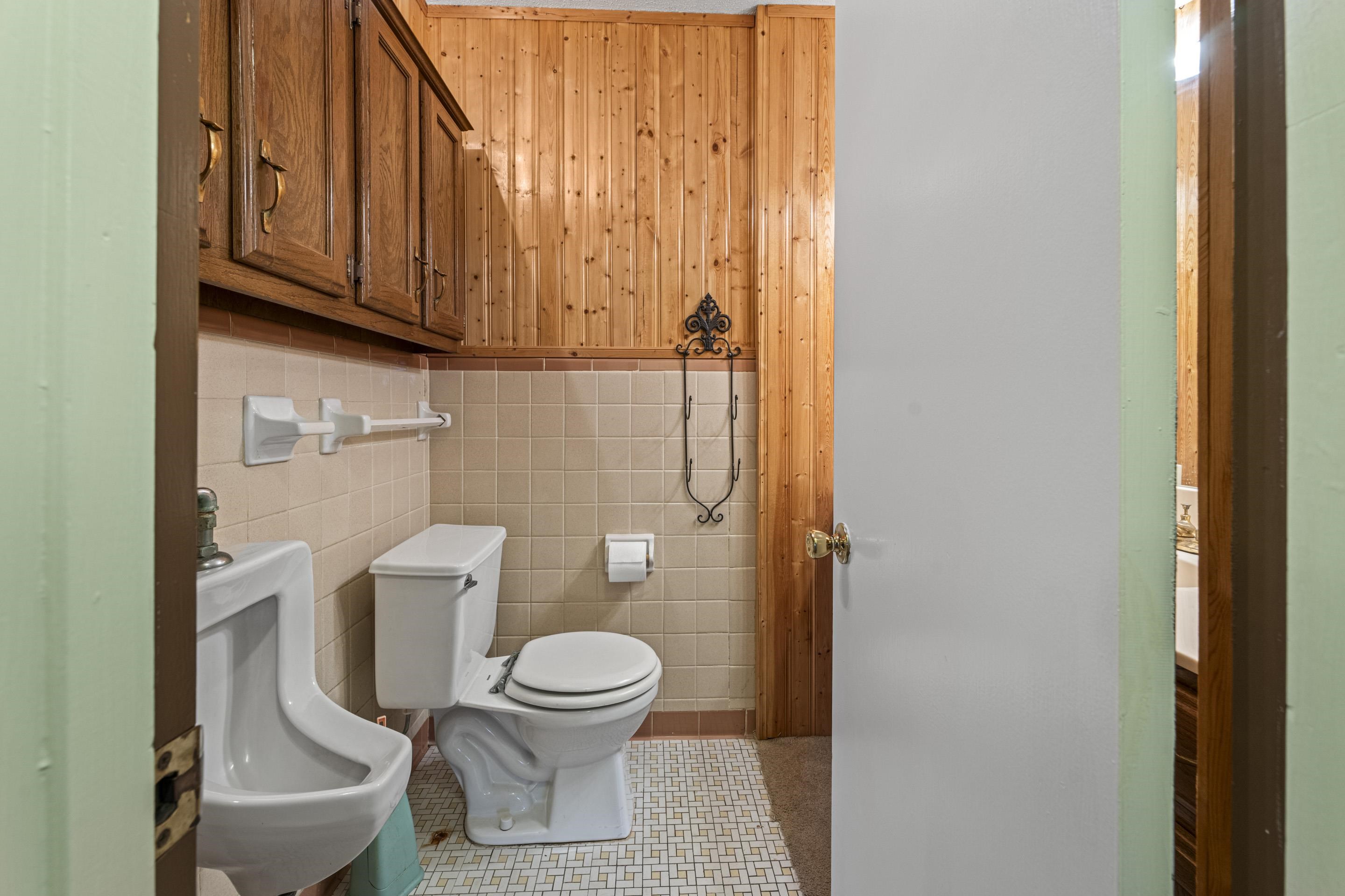 319 Homeville Road Collierville, TN 38017 - Photo 19 of 21 a white toilet sitting next to a shower curtain