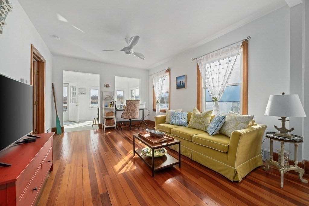 121 Edgewater Road Hull, MA 02045 - Photo 11 of 42 a living room with furniture and a flat screen tv