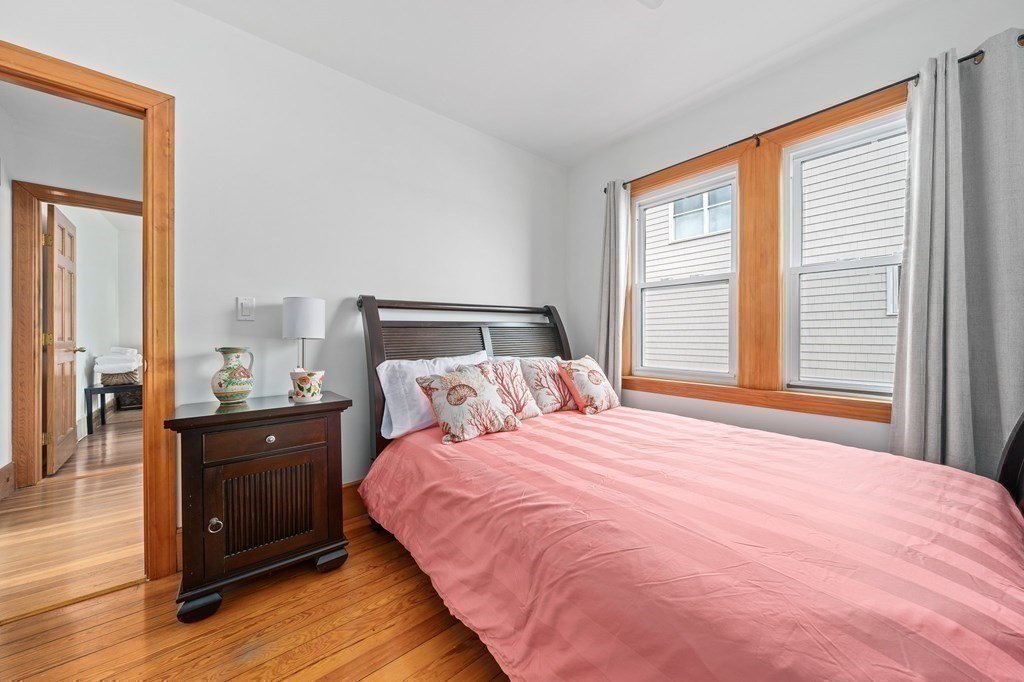 121 Edgewater Road Hull, MA 02045 - Photo 13 of 42 a bedroom with a bed and a large window